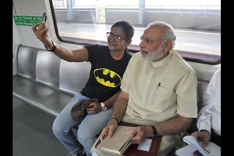Delhi Metro Rail Corp said passengers were ‘very excited’ to see the Prime Minister travelling with them, and local residents stood on rooftops to wave at the train.